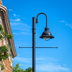 Classic black street lamp against a clear blue sky in Boston, USA
