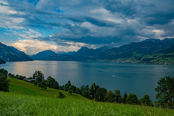 Mountain in the Switzerland in summer, panoramic view with mountain. Switzerland Alps nature and travel. Alpine scenery. Mountain with lake in Switzerland. Summer view over the lake and the alps in