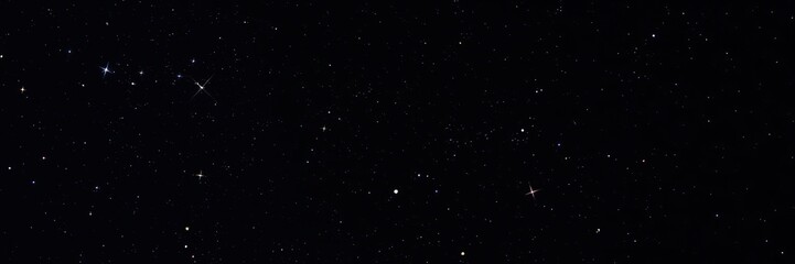 Fototapeta premium Dazzling stars and shooting stars against a midnight black sky, meteorite, universe