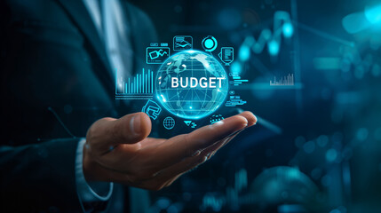 Businessperson holding holographic budget concept with icons and glowing elements