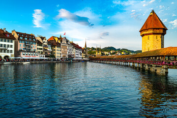 Lucern city with famous Chapel Bridge. Lucerne city view. Canton of Lucerne. Lucern Switzerland. Sunrise in historic city center of Lucerne with famous Chapel Bridge and lake Lucerne.