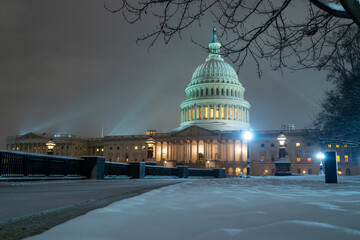 US Washington D. C. in winter night snow. Capitol Building in night. Washington city Capitol....