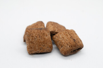 Chocolate pillow cereal isolated on white background