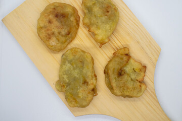 Cangkodok pisang. processed snack from bananas on a wooden coaster