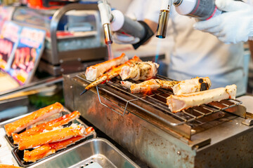 Grilled king crab at fish market in Tokyo, Street food in Japan