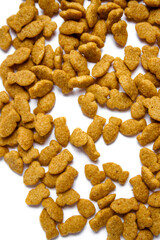 Scattered dry cat food isolated on white background