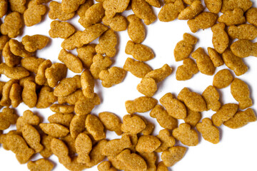 Scattered dry cat food isolated on white background
