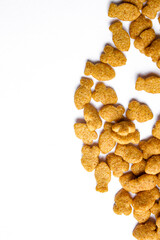 Scattered dry cat food isolated on white background