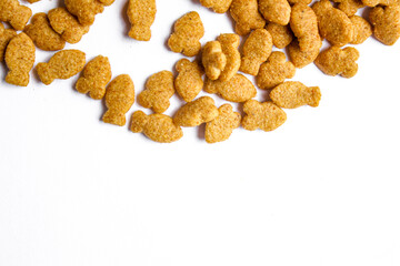 Scattered dry cat food isolated on white background