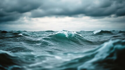 Dark waves rise and fall under heavy clouds, creating an intense and moody atmosphere over the ocean's vast expanse