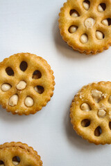 Sandwich biscuits filled with peanut butter flavored cream on white background