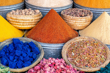 Arrangement of Moroccan spices, herbs and nuts and powder paint