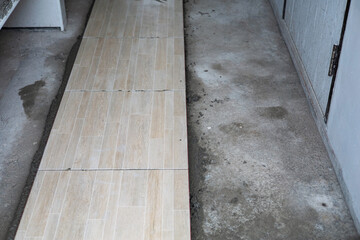 Tiling of unfinished floors awaiting decoration