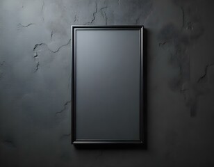 A black framed poster or artwork hanging on a rough concrete wall