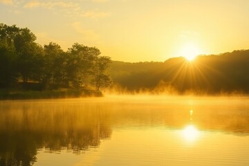 Obraz premium Beautiful Sunrise Over Calm Water with Mist and Silhouetted Trees, Capturing Nature's Splendor in a Serene Landscape at Dawn