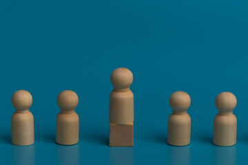 Wooden figures, a symbol of shared purpose. A quiet contemplation of collective action. Individuality amidst the group. A visual representation of professional growth.