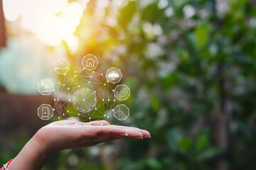 Technology, hand holding with environment Icons over the Network connection on green background.