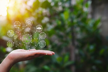 Technology, hand holding with environment Icons over the Network connection on green background.