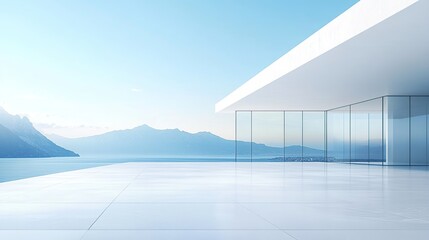 A modern white building with large glass windows overlooking the sea, with a clear blue sky and...