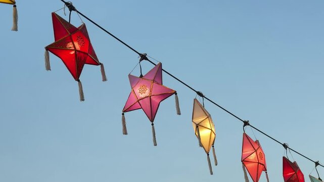 Thailand loi krathong yi peng festival hanging colorful paper lanterns over entrance	