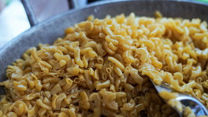 Close-up of classic macaroni and cheese dish with cheese. Macaroni with several flavors