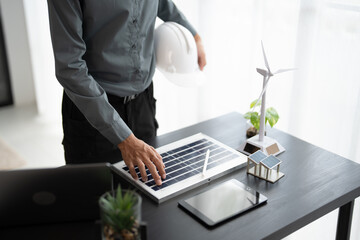 Engineer planning for Solar panels green energy Business man working Innovation  green eco friendly in modern office business  Planing Bio economy for business renewable energy eco friendly