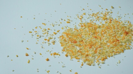 A small pile of breadcrumbs isolated in white background