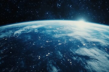 Obraz premium A stunning view of Earth from space, with the sun rising over the horizon.