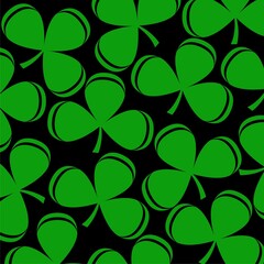 Green clover leaves on black background seamless pattern isolated on black background