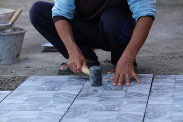 Floor tiles installation. Ceramic tiles and tools for tiler. Home improvement, renovation - ceramic tile floor adhesive