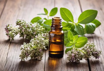 A bottle of essential oil with a sprig of fresh oregano on a wooden table