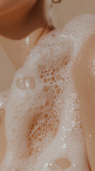 Inviting close up of creamy soap forming rich bubbles on skin