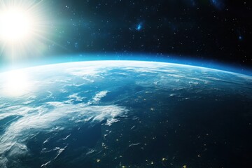 Obraz premium Earth from space with sun rising over horizon.