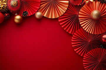 A vibrant top-down view of red and gold paper fans and ornaments, perfect for Chinese New Year celebrations and festive event decorations.