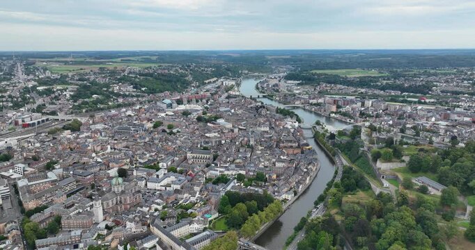 Aerial drone view on the city of Namur in Belgium, the citadel, the Meuse,the Sambre, rivers, cathedrals, houses. Urban overview of the historic city center.