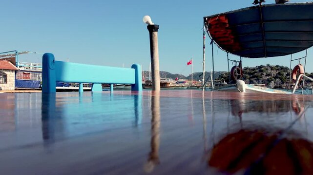 Calm reflections at Demre Harbour, with a view of boats and the horizon, marking the start of Kekova and Simena explorations.