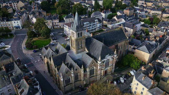 Cathedral of Saint Trinity, Laval in department of Mayenne, France. Aerial drone top down circling