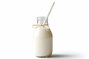 A glass bottle of fresh milk with a white straw on a white background. Soft lighting. Minimalistic canvas for National Milk Day.