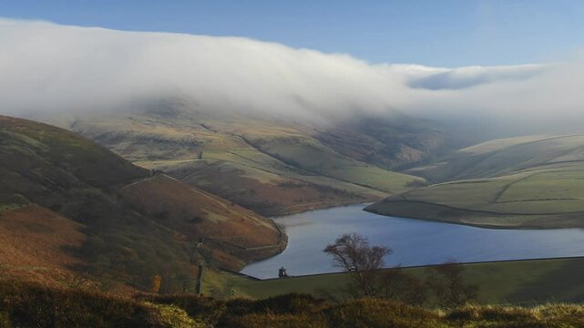 Time-lapse footage of the clouds rolling over Kinder Scout with Kinder reservoir in Derbyshire, UK