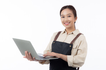 Portrait young asian business woman wearing apron holding laptop computer isolated white background, waitress or barista holding laptop computer with confident, cut out, business or freelance.