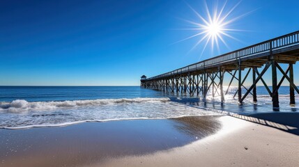 Obraz premium Ocean Pier Sunshine Beach Waves Scenic Coastal Summer View