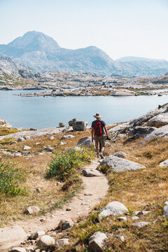 Man hiking down trail in the Wind Rivers