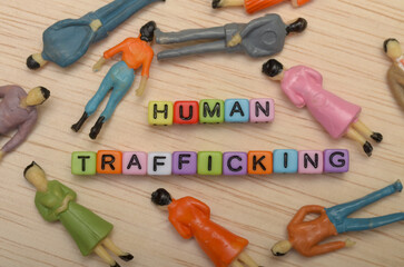 The image symbolizes the exploitation and dehumanization of individuals involved in human...