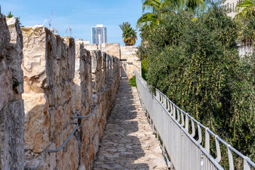 Fototapeta premium Narrow stone path atop a fortress wall near Jaffa Gate in Old Town Jerusalem