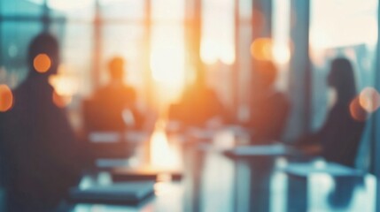 Team meeting at sunset with silhouettes in a bright conference room discussing strategies for future growth