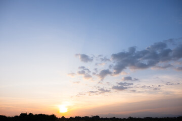 Beautiful sky and cloud at high. Landscape include space, light of nature, sunset, sunrise, horizon or skyline. Colorful with yellow, orange and blue at evening in autumn for background and wallpaper.