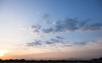 Beautiful sky and cloud at high. Landscape include space, light of nature, sunset, sunrise, horizon or skyline. Colorful with yellow, orange and blue at evening in autumn for background and wallpaper.