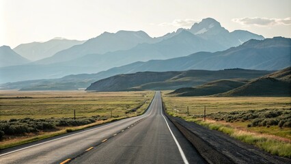 A scenic drive on a straight asphalt road through a vast open landscape with rolling hills and towering mountains visible beyond the horizon, isolation, asphalt road, serenity