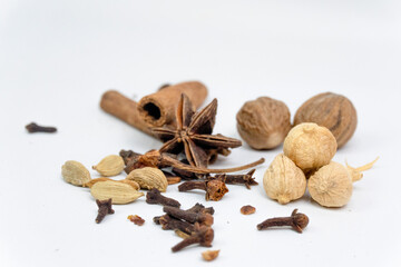 variation of different herbs and spices on white background. traditional spices.