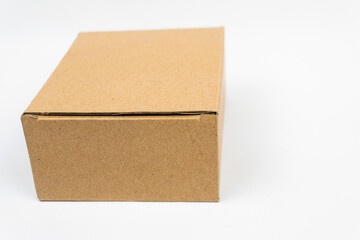 Brown cardboard box isolated on white background. Suitable for packaging stuff.